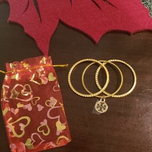 Tory Burch gold ocean wave bangles